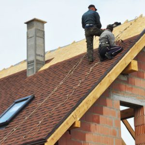 Roofers Install Shingles on a New Roof